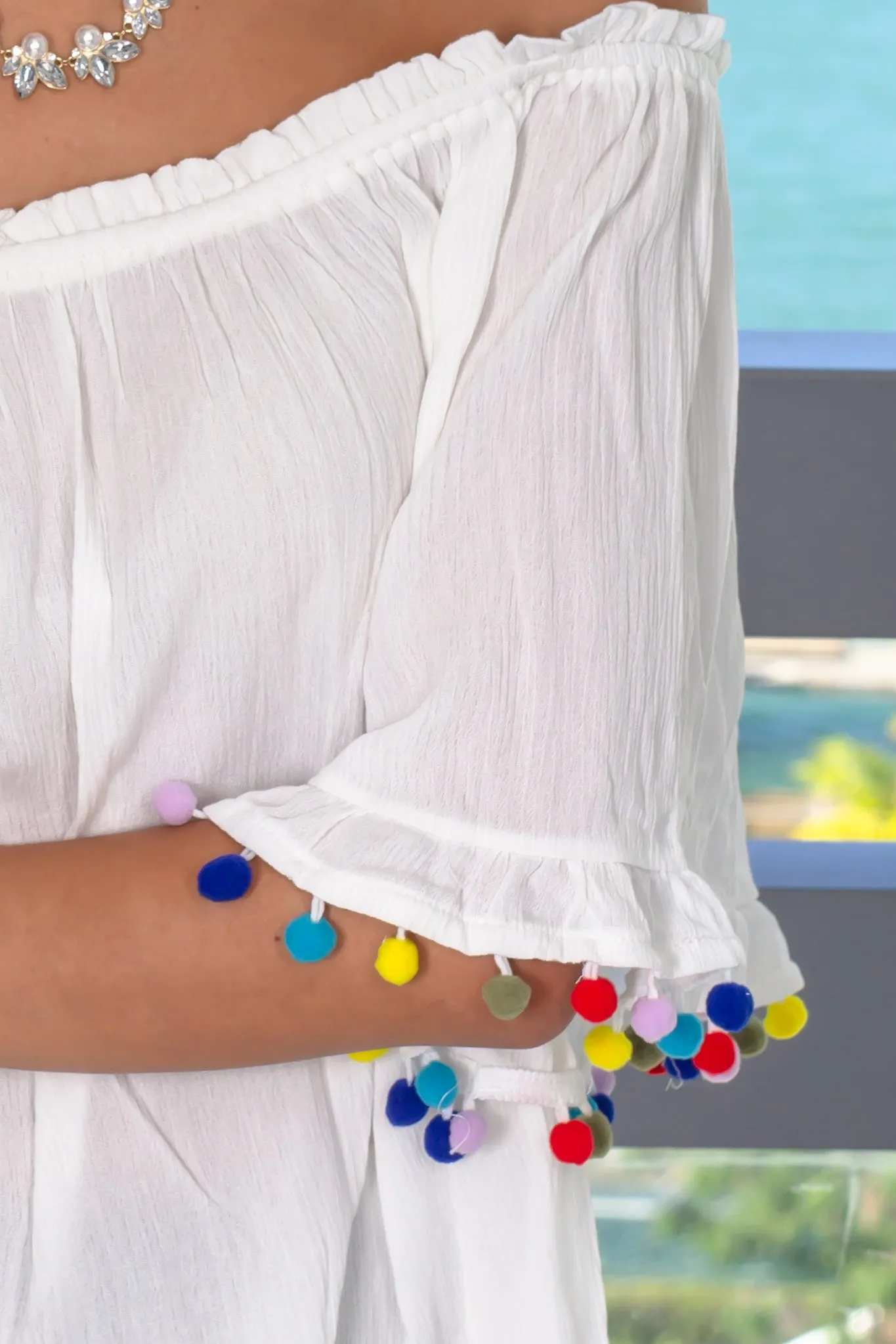 Off White Top with Pom Poms